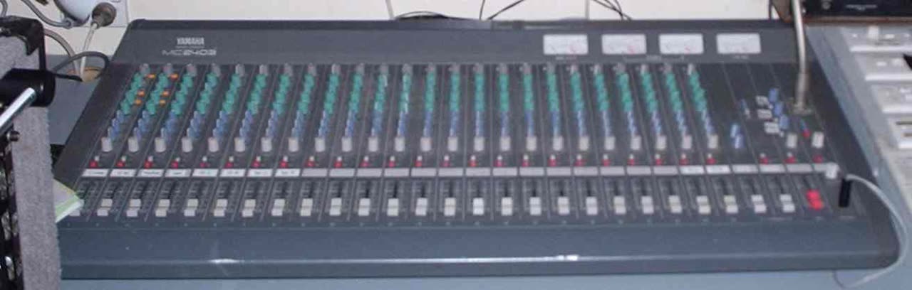 An audio mixing console with sliders